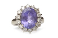 Lot 15 - TANZANITE AND DIAMOND CLUSTER RING set with a...