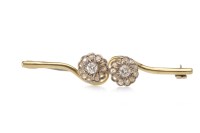 Lot 74 - DIAMOND CLUSTER BAR BROOCH in the form of two...
