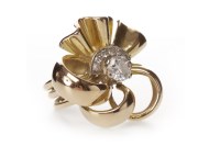 Lot 140 - FLORAL MOTIF DIAMOND RING set with a central...