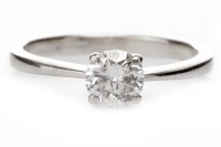 Lot 157 - DIAMOND SOLITAIRE RING with a four claw set...