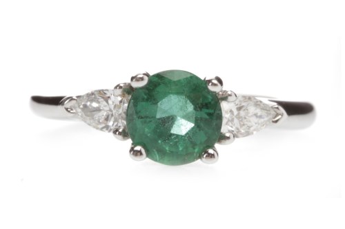 Lot 250 - EMERALD AND DIAMOND THREE STONE RING set with...