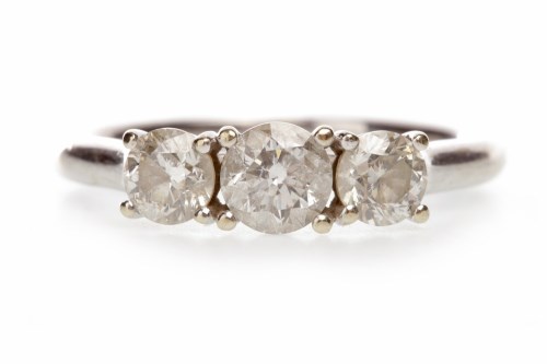 Lot 270 - DIAMOND THREE STONE RING set with graduated...