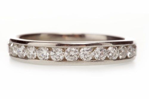Lot 272 - DIAMOND HALF ETERNITY RING with a row of...