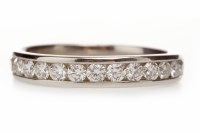 Lot 272 - DIAMOND HALF ETERNITY RING with a row of...