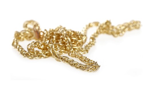 Lot 284 - NINE CARAT GOLD CHAIN formed by fancy triple...