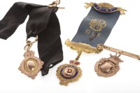 Lot 297 - THREE NINE CARAT GOLD FOB CHARMS including one...