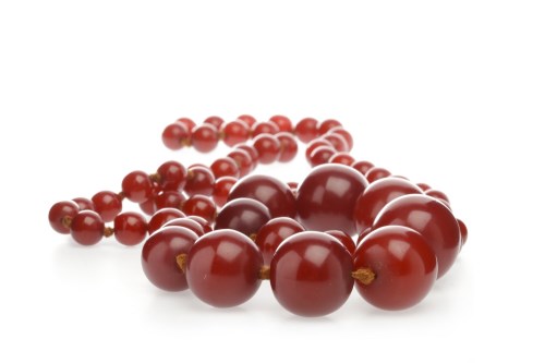 Lot 298 - BAKELITE BEAD NECKLACE formed by round beads,...