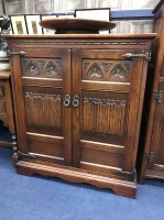 Lot 295 - OAK COCKTAIL CABINET along with a similar two...