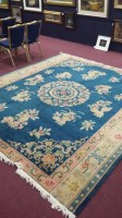 Lot 352 - CHINESE BORDERED CARPET decorated with large...