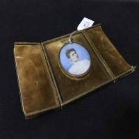 Lot 400 - VICTORIAN PORTRAIT MINIATURE of a lady, in a...