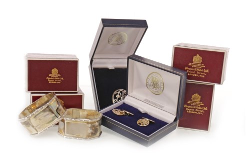 Lot 911 - SET OF FOUR MAPPIN & WEBB SILVER NAPKIN RINGS...