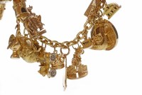 Lot 516 - CHARM BRACELET with charms including a postbox...