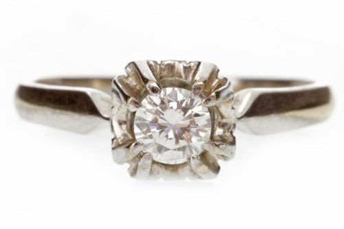 Lot 576 - DIAMOND SINGLE STONE RING 1960s, with a round...