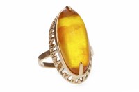 Lot 609 - BALTIC AMBER DRESS RING set with a large...