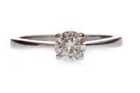 Lot 665 - DIAMOND SOLITAIRE RING with a four claw set...