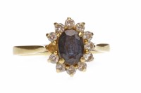 Lot 687 - BLUE GEM AND DIAMOND CLUSTER RING set with a...