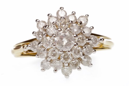 Lot 688 - DIAMOND DRESS RING the large tiered snowflake...