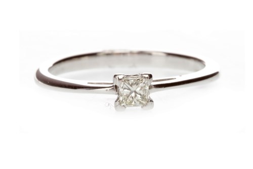 Lot 697 - DIAMOND SOLITAIRE RING with a four claw set...