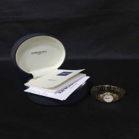 Lot 415 - LADY'S RAYMOND WEIL GOLD-PLATED BRACELET WATCH...