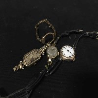 Lot 430 - LADIES' GARRARD GOLD WRIST WATCH along with...