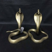 Lot 471 - PAIR OF EASTERN BRASS CANDLESTICKS in the form...