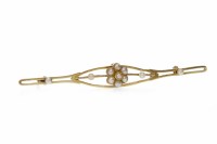 Lot 613 - EDWARDIAN GOLD PEARL SET BROOCH in the form of...