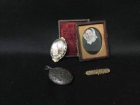 Lot 7 - SILVER OVAL LOCKET ENGRAVED WITH FOLIAGE also...