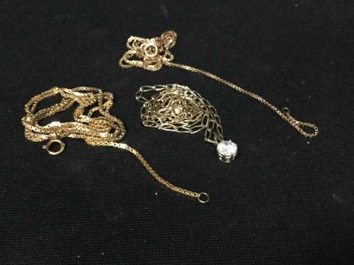 Lot 12 - GOLD NECKCHAIN WITH WHITE STONE DROP along...