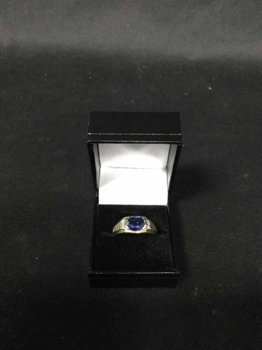 Lot 44 - BLUE GEM STONE AND DIAMOND DRESS RING set in...