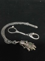 Lot 46 - SILVER DOLL PENDANT ON A SILVER CHAIN along...