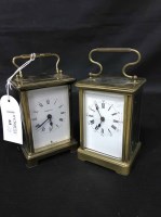 Lot 64 - TWO BRASS CARRIAGE CLOCKS both with swing handles