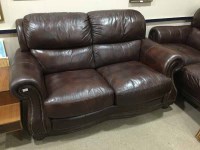 Lot 213 - TWO BROWN LEATHER SETTEES AND A STOOL