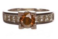 Lot 67 - COLOURED DIAMOND DRESS RING set with a round...