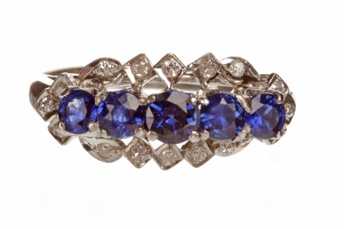 Lot 77 - BLUE GEM AND DIAMOND DRESS RING set with five...