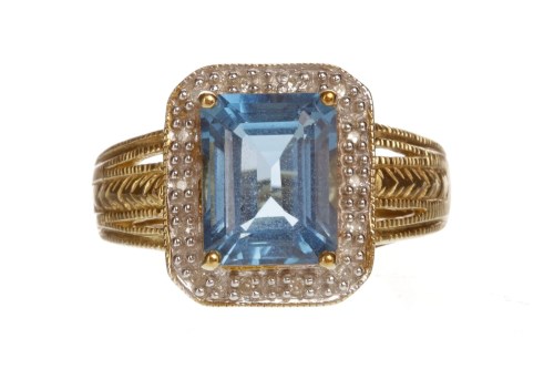 Lot 81 - TOPAZ AND DIAMOND RING set with a single...