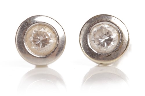 Lot 91 - PAIR OF DIAMOND EARRINGS each set with a round...