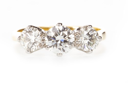 Lot 159 - DIAMOND THREE STONE RING set with a central...
