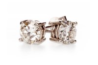 Lot 186 - PAIR OF DIAMOND EARRINGS one set with a round...