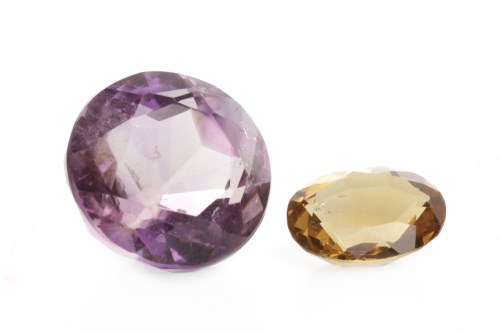 Lot 198 - UNMOUNTED AMETHYST AND CITRINE the amethyst of...