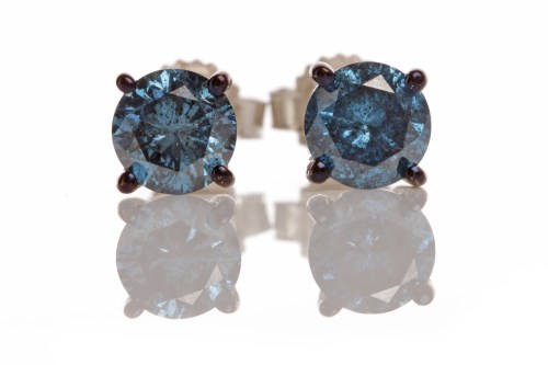 Lot 219 - PAIR OF BLUE DIAMOND EARRINGS each set with a...
