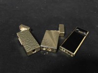 Lot 202 - GOLD PLATED VENUS LIGHTER along with two Win...