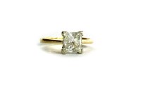 Lot 9 - DIAMOND SOLITAIRE RING set with a princess cut...