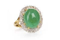 Lot 225 - GREEN GEM SET AND DIAMOND RING set with an...