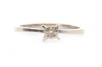 Lot 520 - DIAMOND SOLITAIRE RING set with a round...