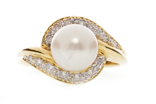 Lot 527 - DIAMOND AND PEARL DRESS RING set with a single...