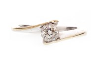 Lot 552 - DIAMOND SINGLE STONE RING with a round...