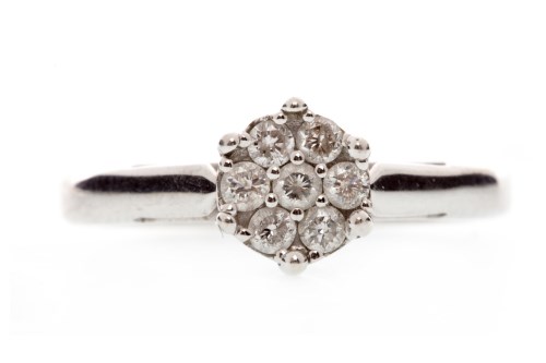 Lot 560 - DIAMOND CLUSTER RING the floral bezel set with...