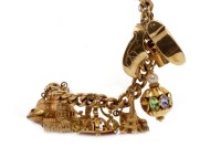 Lot 569 - NINE CARAT GOLD CURB LINK BRACELET with charms...
