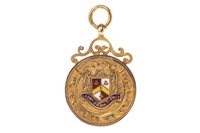 Lot 73 - A GOLD AND ENAMEL MEDAL