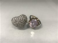 Lot 99 - A PURPLE GEM SET RING AND A HEART SHAPED RING